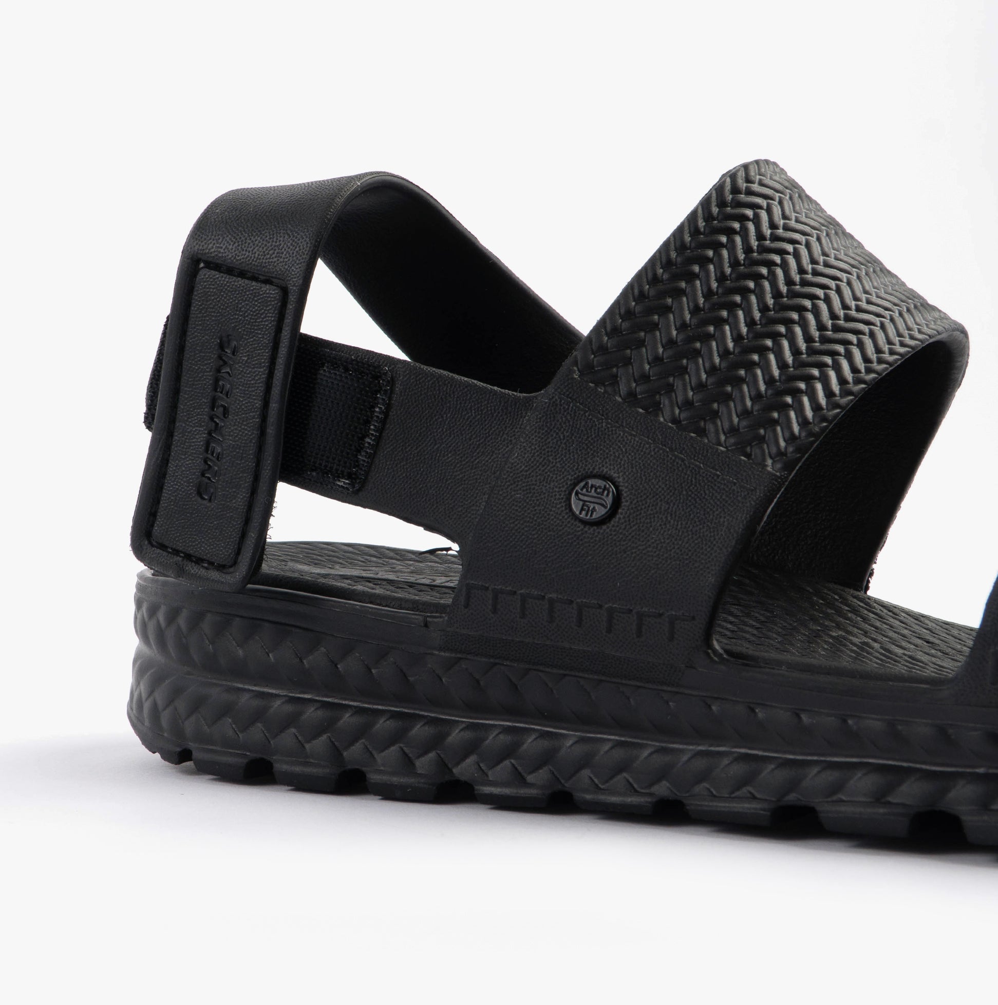 Skechers 111461/BBK ARCH FIT FOOTSTEPS - SUNNY DAYS Womens Sandals Black side view showcasing black synthetic upper.