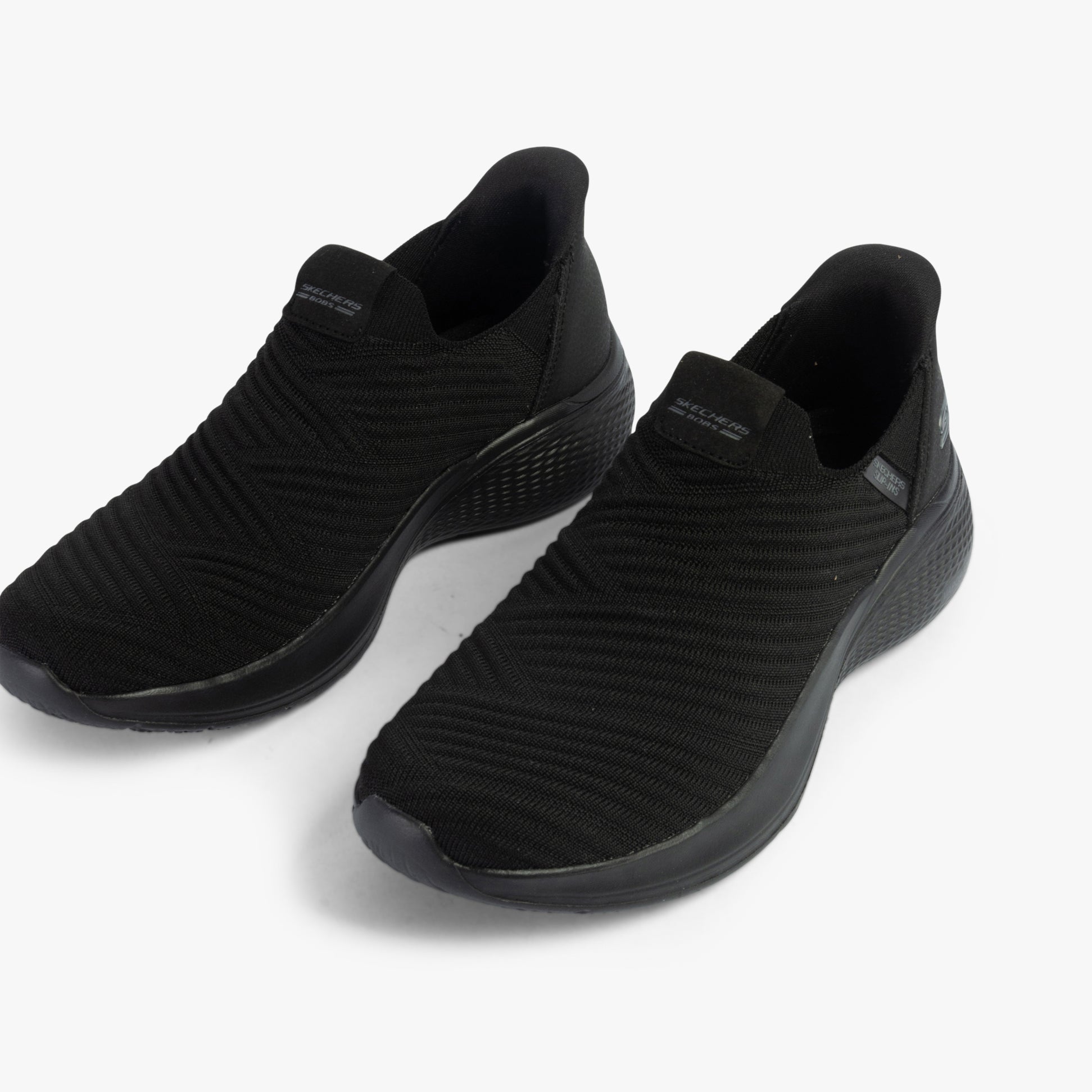 Skechers 117508/BBK BOBS INFINITY - DAILY VISION Womens Trainers Black side view showing slip-on design and synthetic upper.