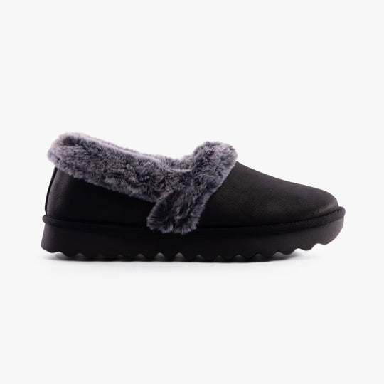 Skechers 169027/BLK COZY UP Womens Slippers Black side view featuring soft fur lining and slip-on design.