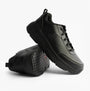 Skechers MAX CUSHIONING ELITE SR-FILCH Mens Workwear Trainers Black, side view of black lace-up sneaker with slip-resistant sole.