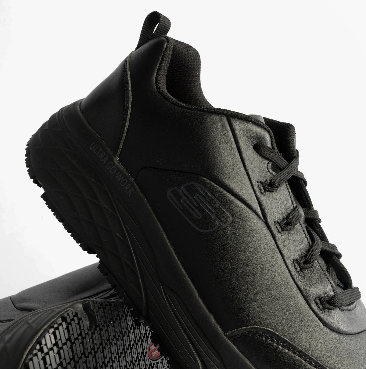 Side view of Skechers MAX CUSHIONING ELITE SR-FILCH Mens Workwear Trainers Black with lace-up closure and slip-resistant sole.
