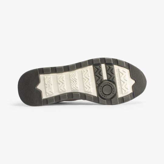 TOMS TRVL LITE RETRO Mens Trainers Grey sole view with rubber material and textured design.