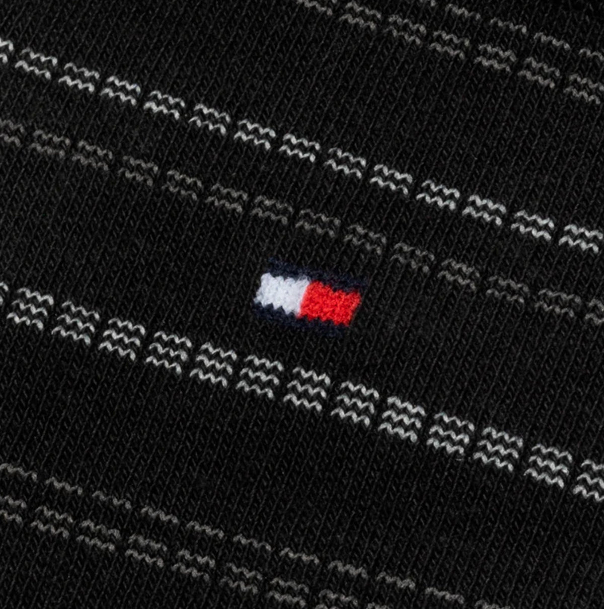 Tommy Hilfiger 4 Pack Giftboxed Classic Mens Crew Socks Black detail view showing logo and design pattern.