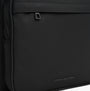 Tommy Hilfiger REPREVE Metal Logo Backpack Black detail view showing zipper and logo.