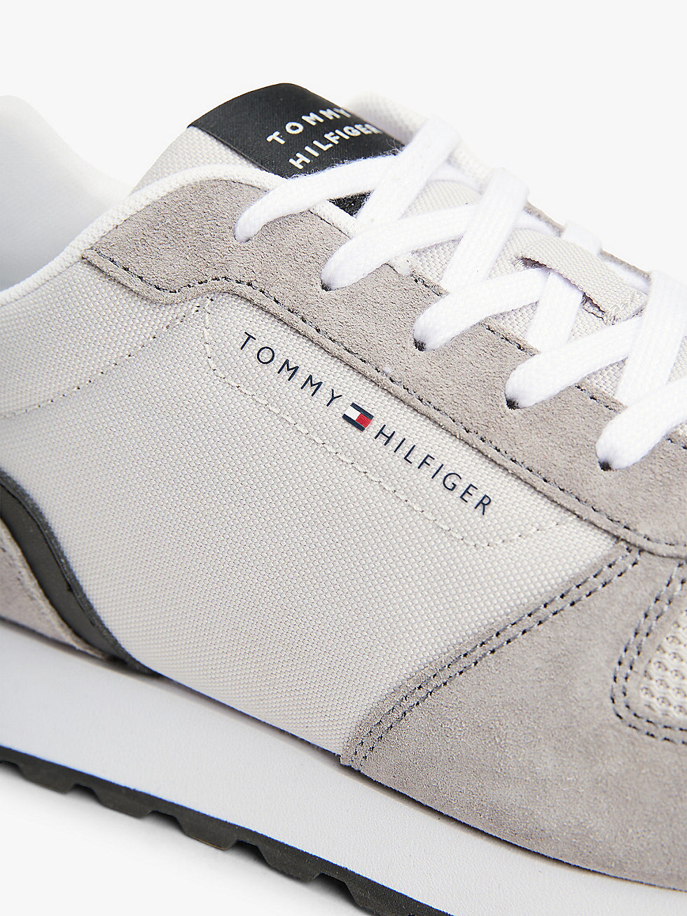 Tommy Hilfiger NEW RUNNER EVA MIX Mens Trainers Grey Whisper close-up detail view showcasing suede and textile materials.