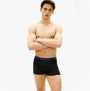Tommy Hilfiger Mens 3 Pack Signature Repeat Logo Waistband Trunks black front view on model showcasing waistband design.