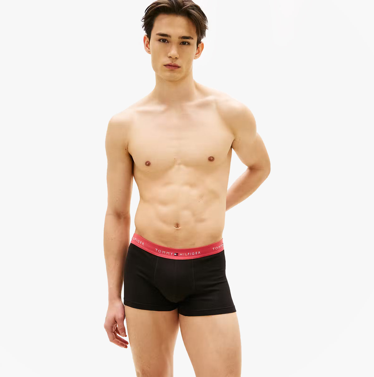 Tommy Hilfiger Mens 3 Pack Signature Repeat Logo Waistband Trunks black front view on model, showcasing waistband detail.
