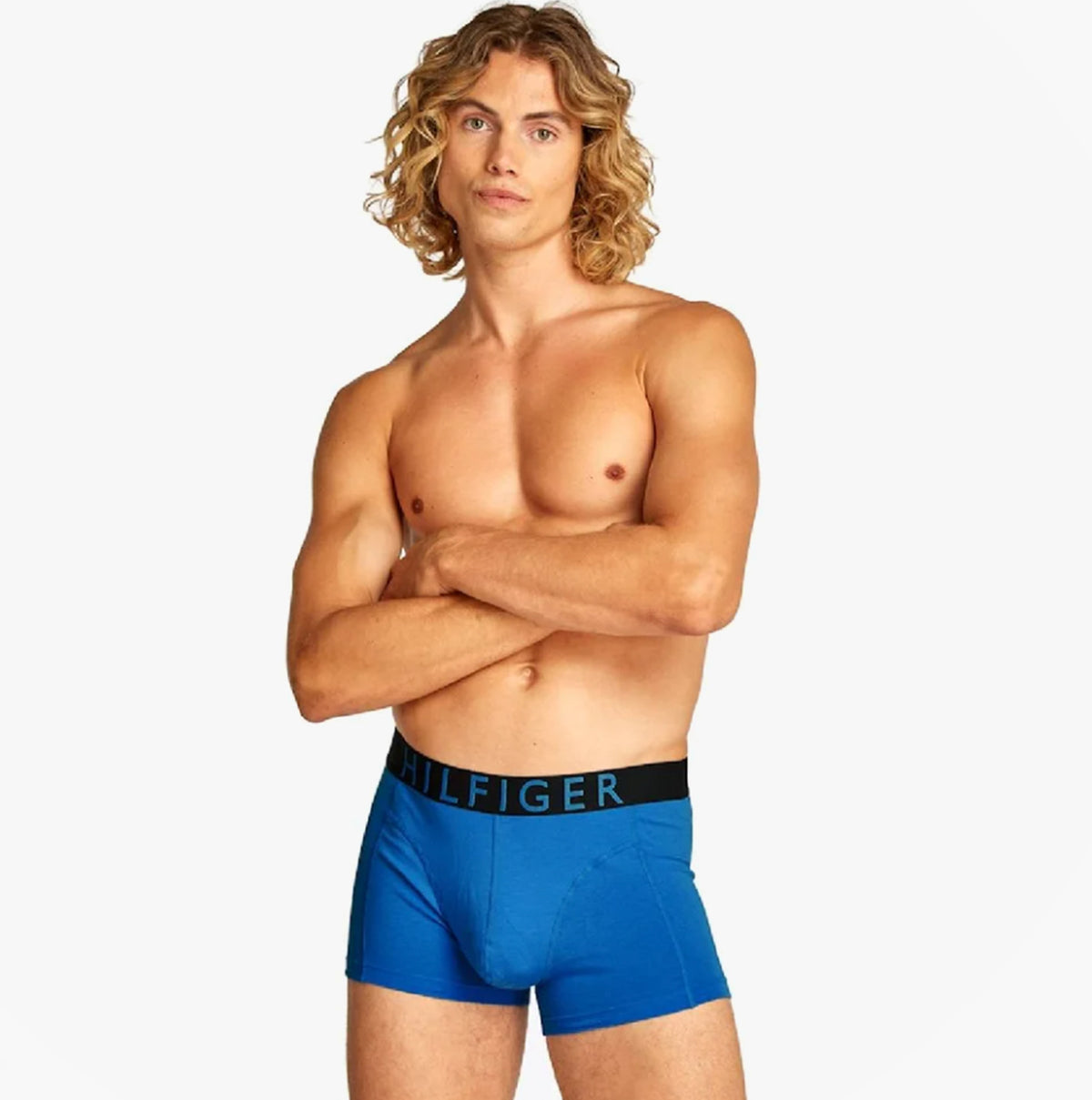 Tommy Hilfiger TRUNK 3 Pack Mens Trunk Multicoloured front view featuring a model in blue underwear with contrasting waistband.