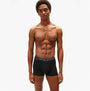 Tommy Hilfiger Mens 3 Pack Trunks Grey/Black/White front view model wearing black trunks