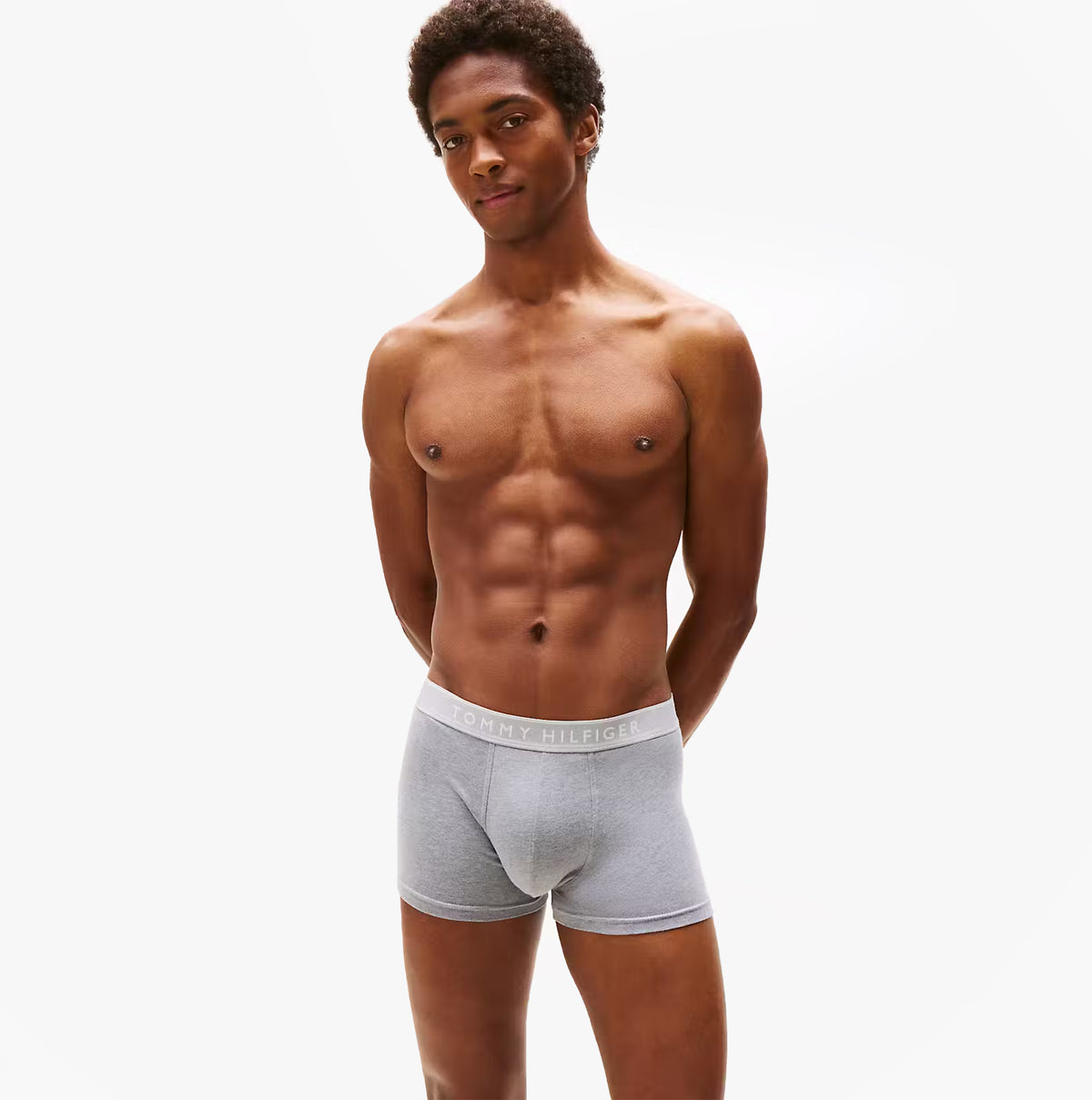 Tommy Hilfiger Mens 3 Pack Trunks Grey/Black/White front view on model showcasing fit and design.