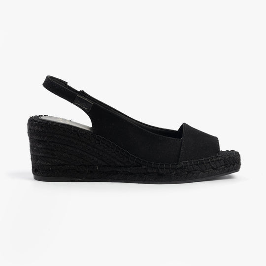 Toni Pons FIORE Womens Sandals Black side view showcasing wedge heel design and textile upper.