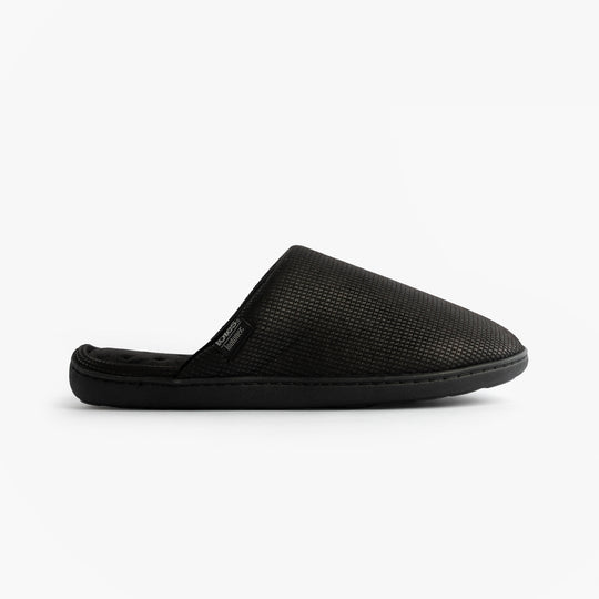 Totes Isotoner SQUARE PATTERNED SMART MULE Mens Mule Slippers Black side view showing textured upper design.